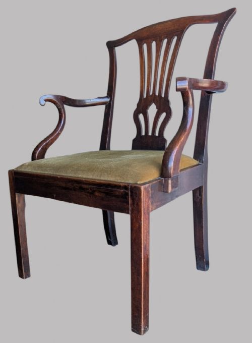 A Georgian mahogany elbow chair featuring a carved pierced back splat, curved arms, and an olive green fabric seat cushion on square legs. View III
