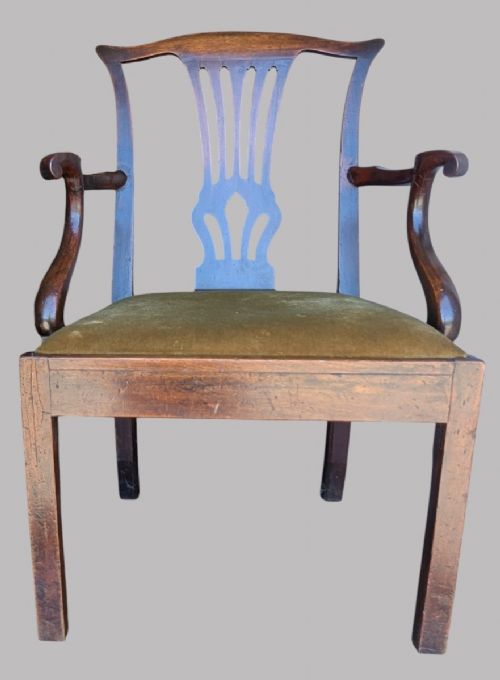 A Georgian mahogany elbow chair featuring a carved pierced back splat, curved arms, and an olive green fabric seat cushion on square legs. View VI