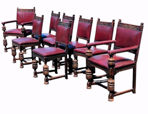 A SET OF EIGHT OAK DINING CHAIRS