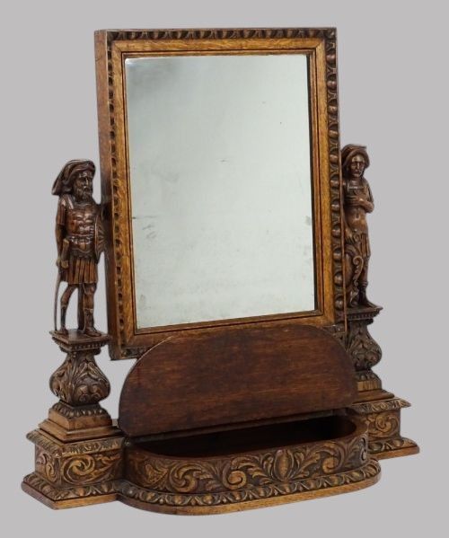 AN IMPRESSIVE CARVED OAK DRESSING MIRROR