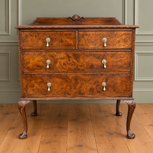 A Burr Walnut Queen Anne Style Chest of Drawers.