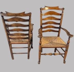 fig 2. A set of eight dark wood ladderback dining chairs with hand-woven rush seats, including two armchairs and six side chairs.