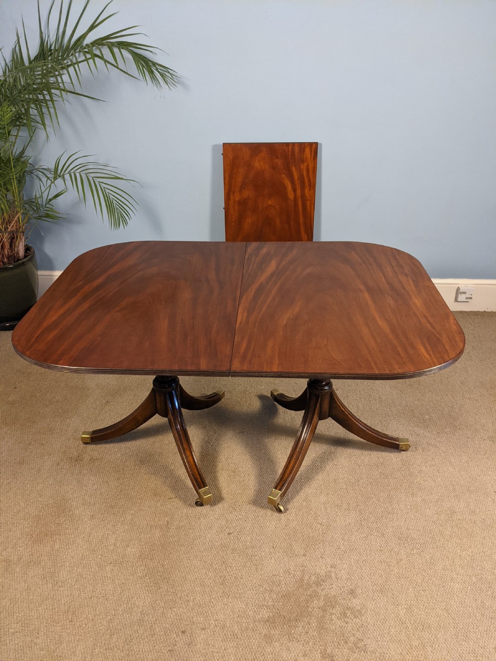 A Regency style mahogany double pedestal dining table. View III