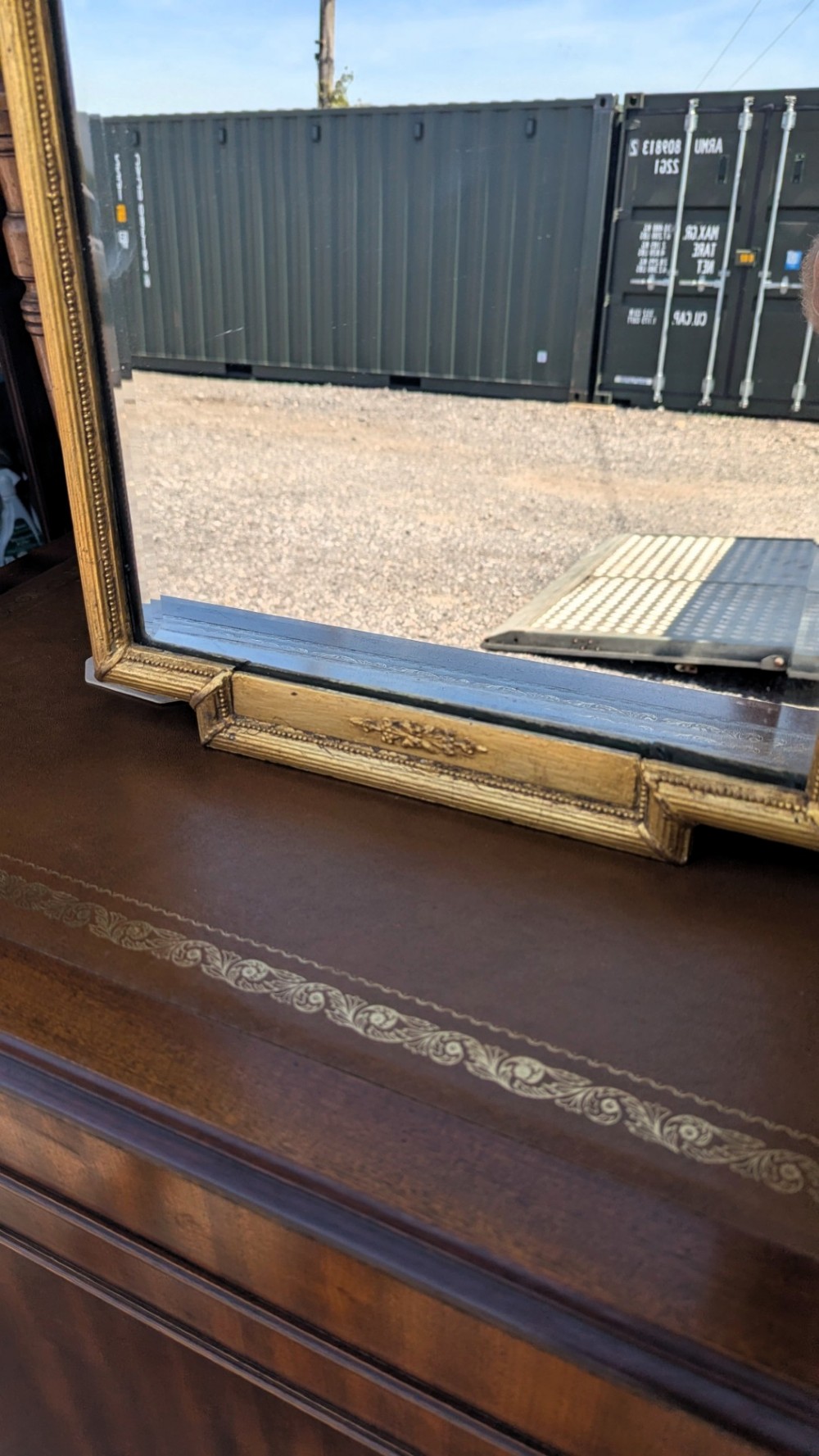 An arched giltwood pier mirror featuring a ribbon bow crest and an upper oval painted scene framed by laurel wreaths above a glass plate. View VII