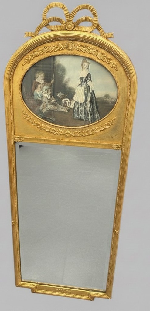 An arched giltwood pier mirror featuring a ribbon bow crest and an upper oval painted scene framed by laurel wreaths above a glass plate. View II
