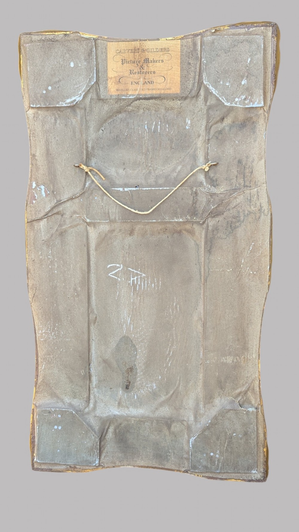 An elongated vertical giltwood pier mirror featuring an upper painted landscape panel above a rectangular glass mirror, set within a carved rococo-style frame. View IX