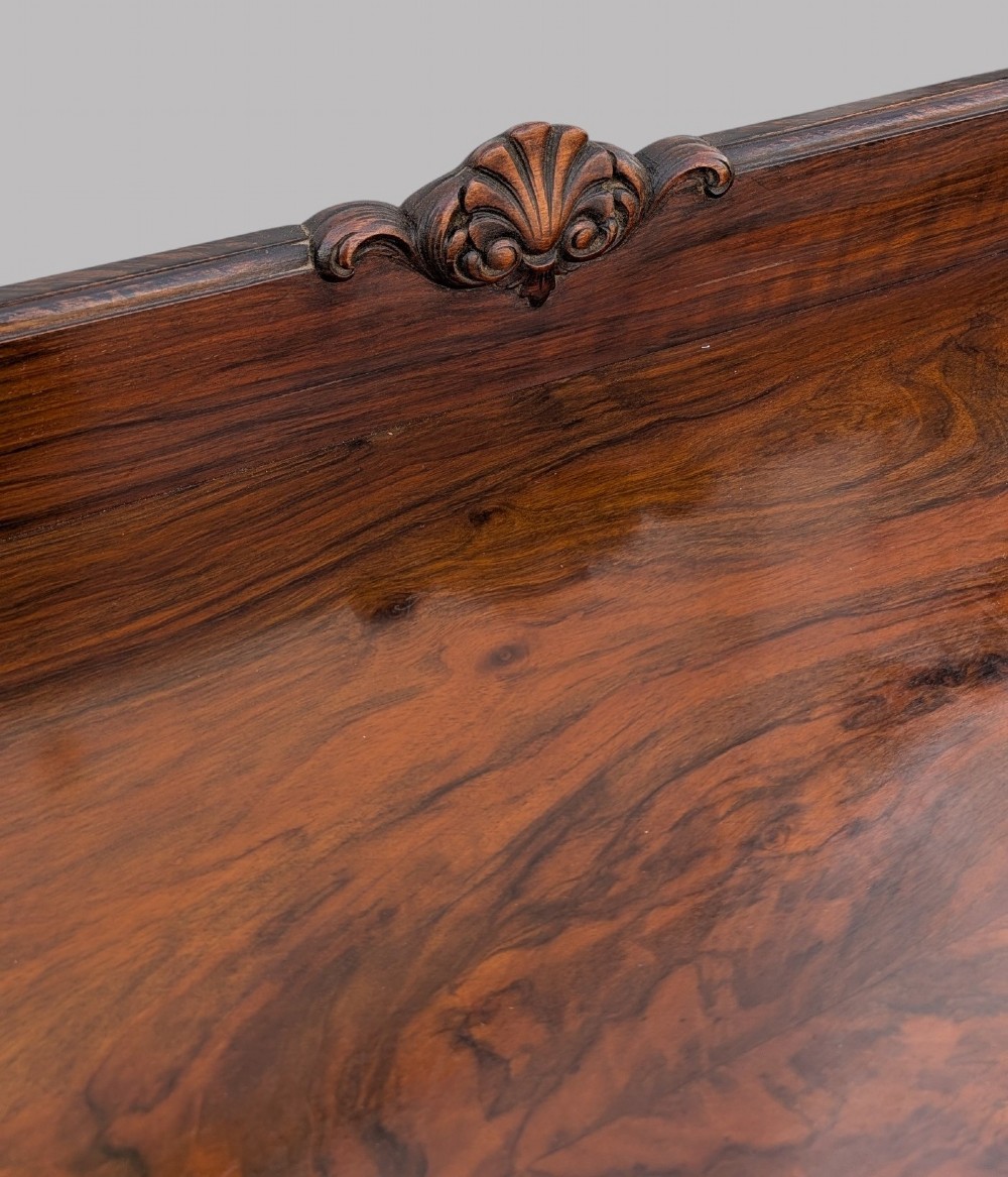 A Queen Anne style burr walnut chest of drawers featuring two short over two long drawers, brass drop handles, and carved cabriole legs. View IX