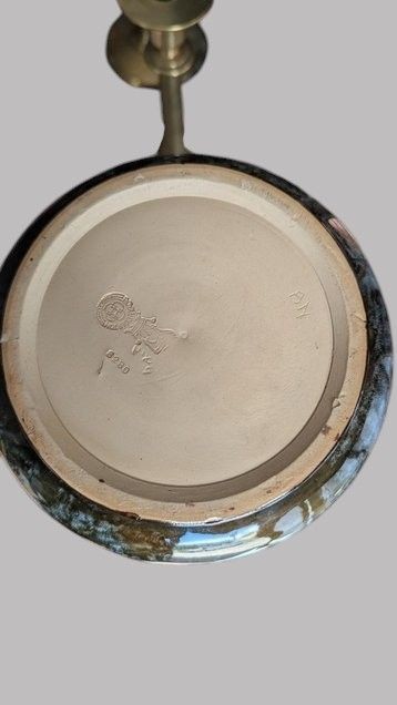 A matching pair of Art Nouveau stoneware vases featuring flared bases, mottled blue and brown glazes, and stylised floral relief decoration. View VII