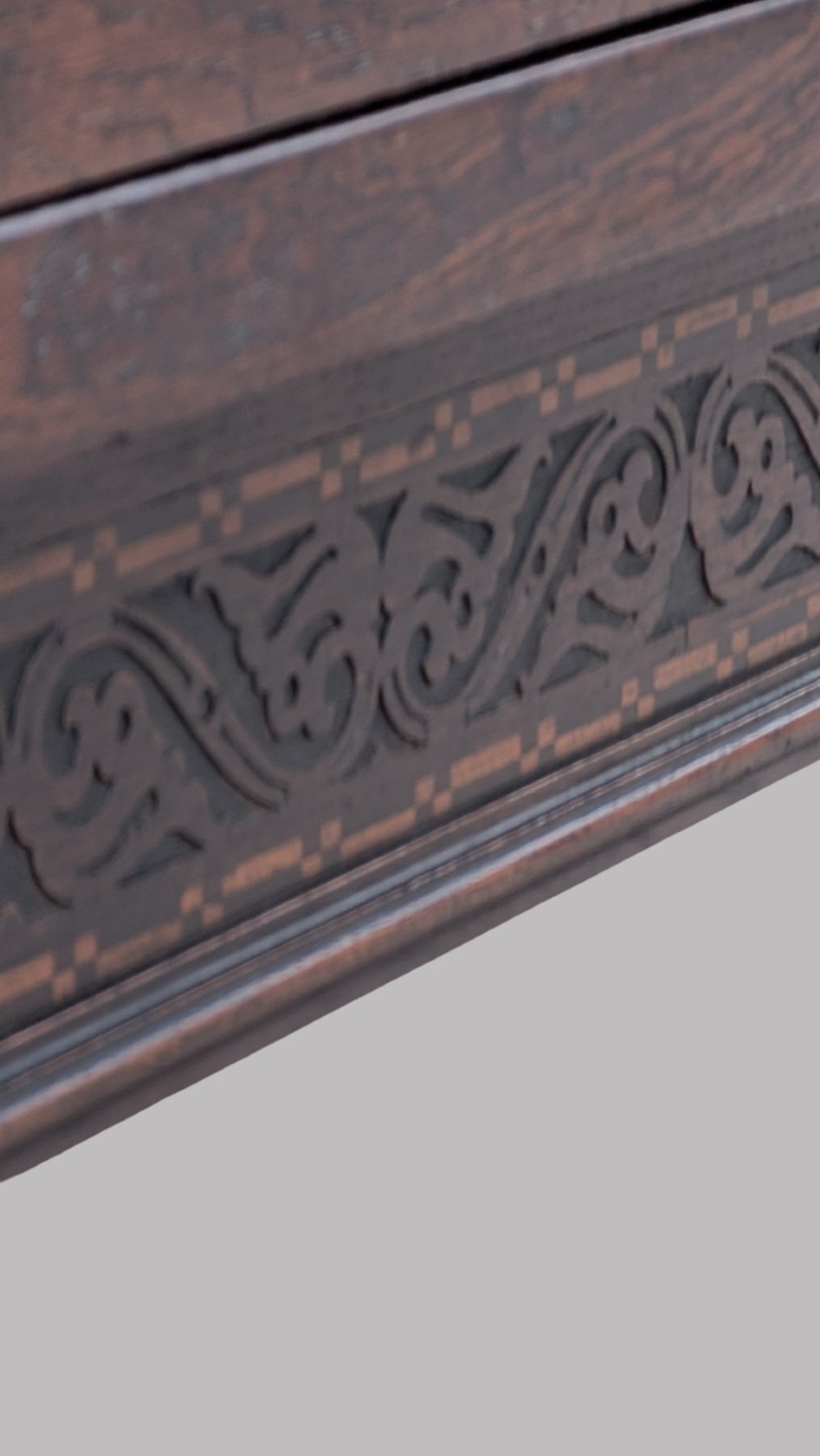 A rectangular extending oak dining table showing a quarter-sawn timber surface and carved bulbous legs underneath. View VII
