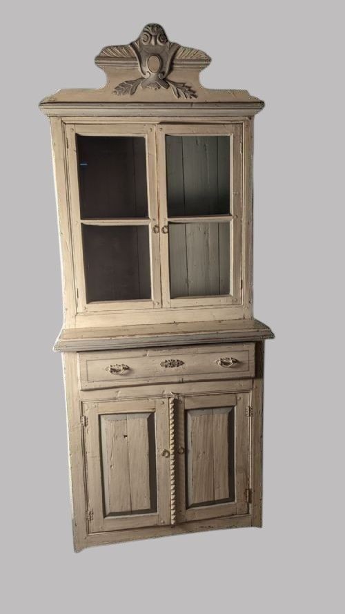 A two-tier 19th-century French painted cupboard featuring upper glazed doors with a carved pediment and lower panelled cabinet doors. View VII