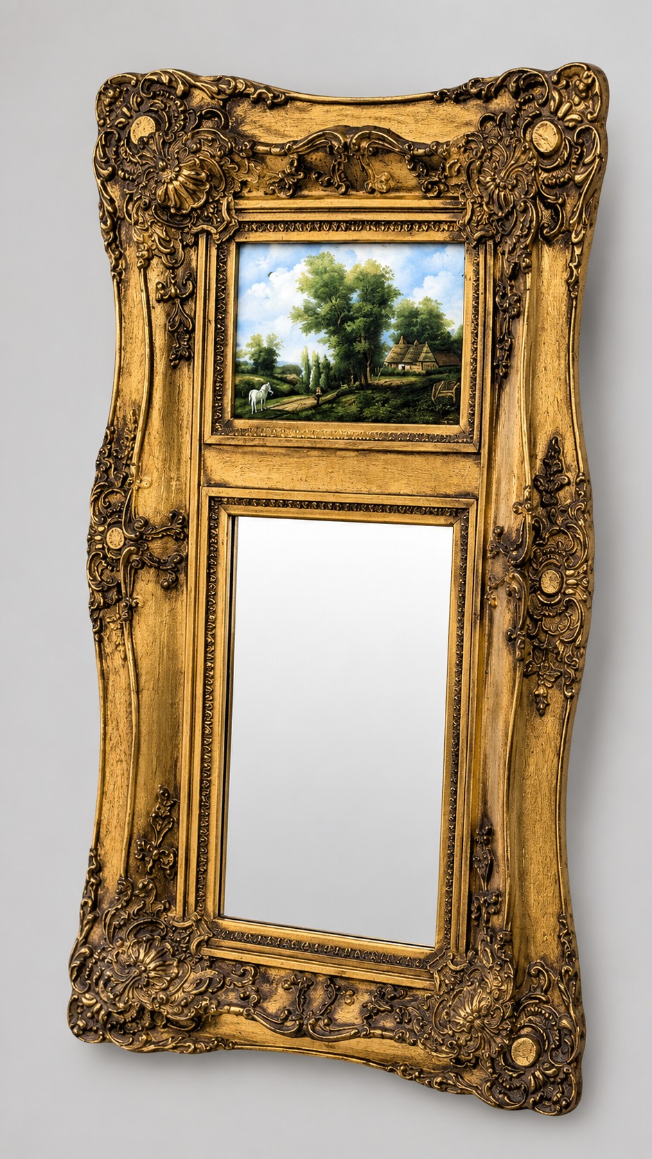 An elongated vertical giltwood pier mirror featuring an upper painted landscape panel above a rectangular glass mirror, set within a carved rococo-style frame.