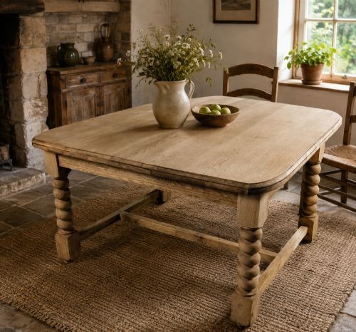 A late Victorian low bleached oak table featuring turned bobbin legs, a rectangular top with rounded corners, and a perimeter stretcher base. View V