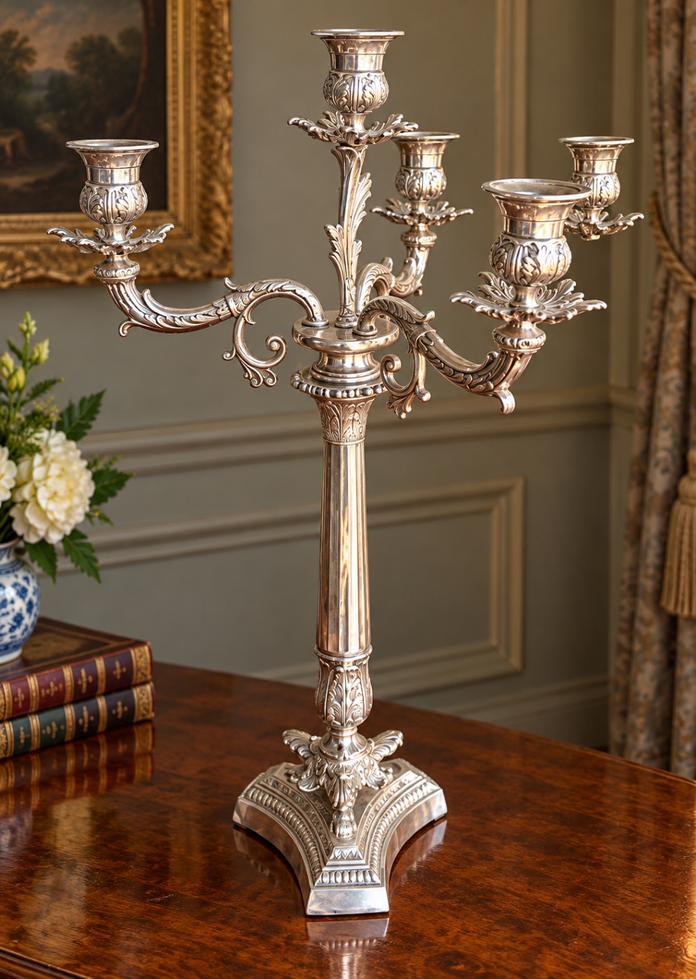 A pair of Victorian silver-plated four-branch candelabras featuring ornate acanthus leaf motifs, fluted columns, and decorative bases. View IV