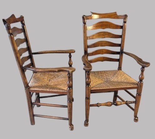 A set of eight dark wood ladderback dining chairs with hand-woven rush seats, including two armchairs and six side chairs. View X