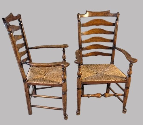 A set of eight dark wood ladderback dining chairs with hand-woven rush seats, including two armchairs and six side chairs. View XII