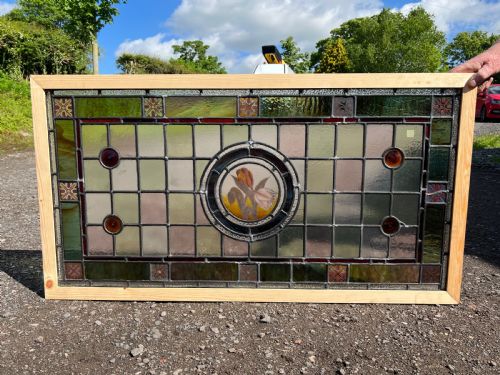 A Large Painted and Leaded Glass Window