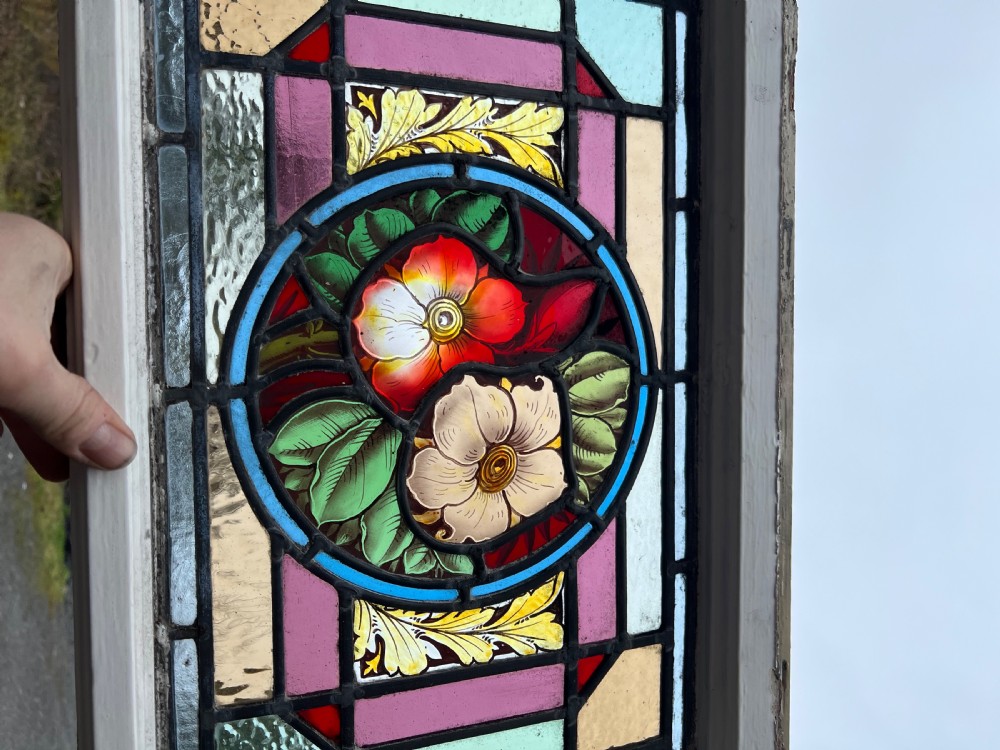 A fantastic stained glass window with painted flowers View III