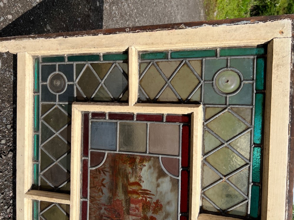 A rare painted and leaded glass window View IV