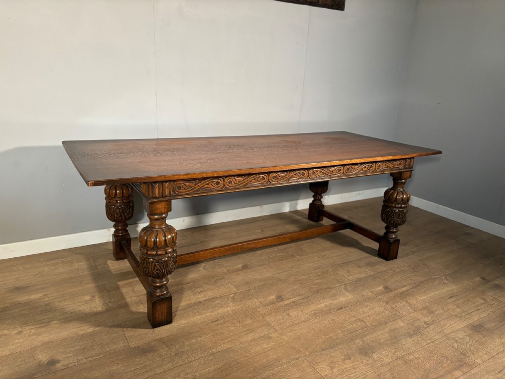 A good Jacobean revival carved oak refectory table 