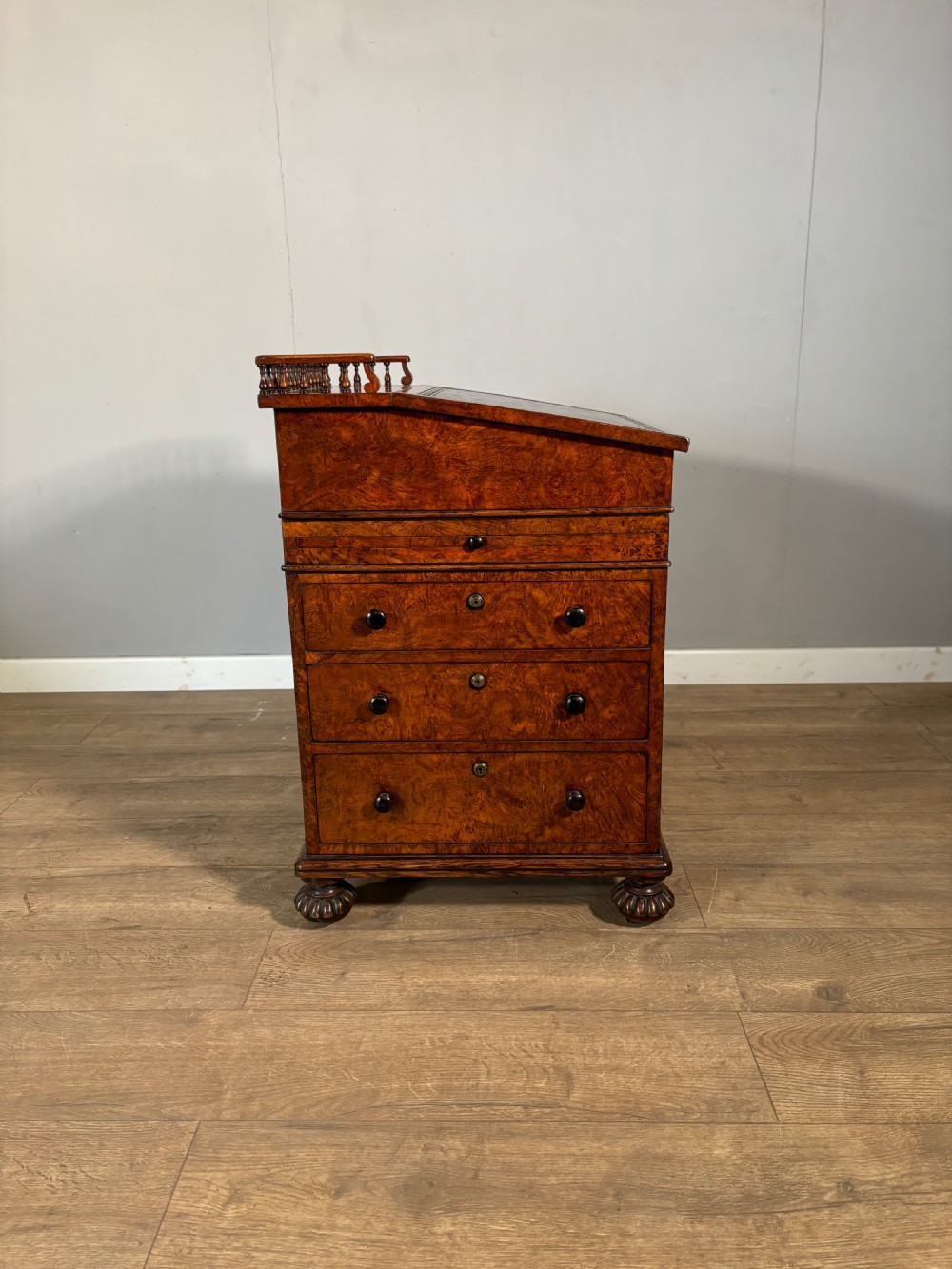An exceptional Gillows regency davenport in pollard oak 