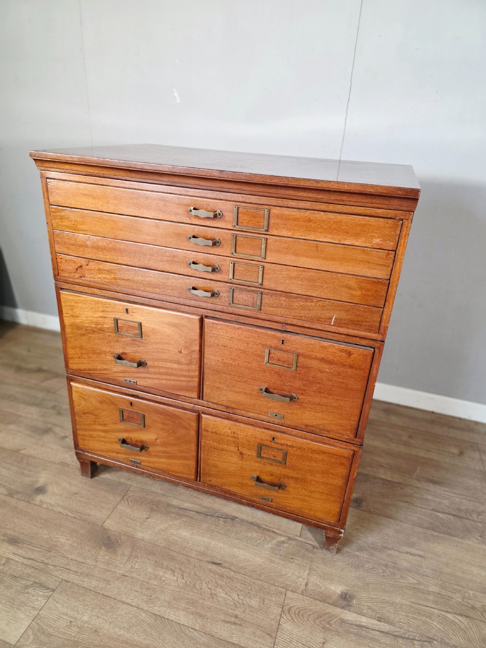 A vintage wooden sectional plan chest with multiple shallow and deep drawers fitted with brass pulls. View III