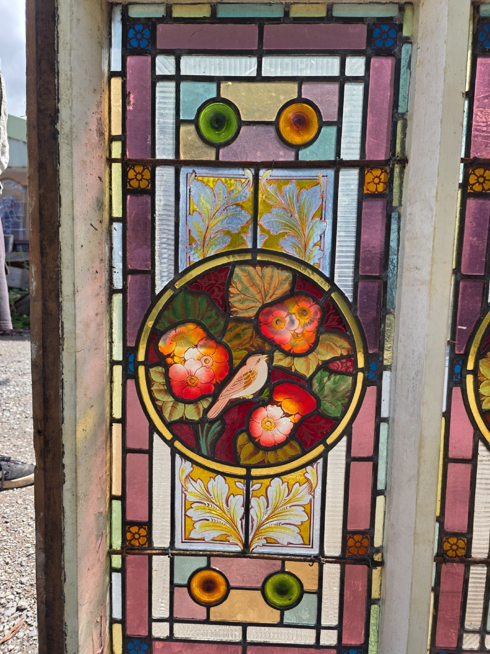 1880 antique leaded glass window with amber and green bullseyes and birds on flowers design  View VII