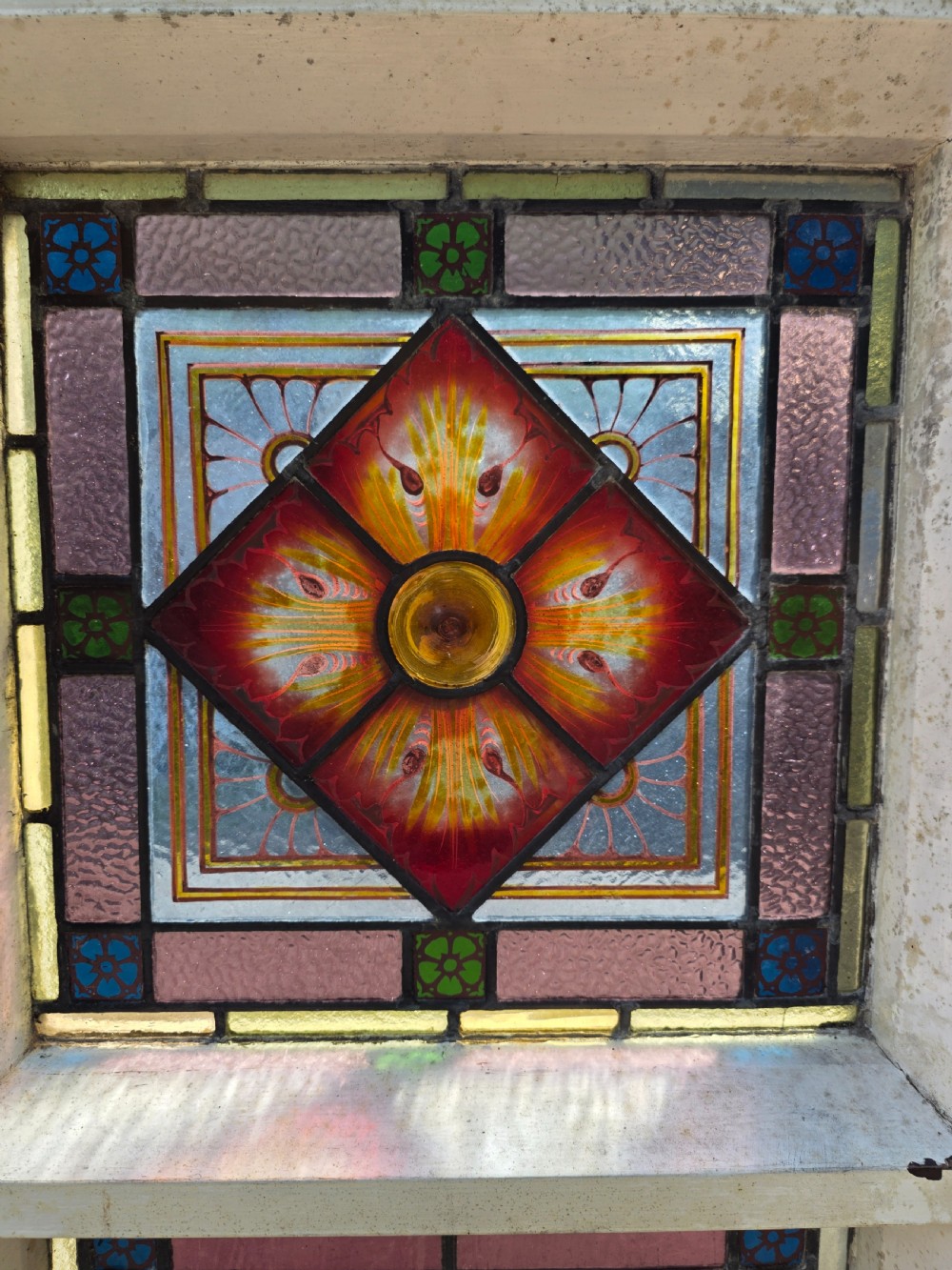 1880 antique leaded glass window with amber and green bullseyes and birds on flowers design  View IX