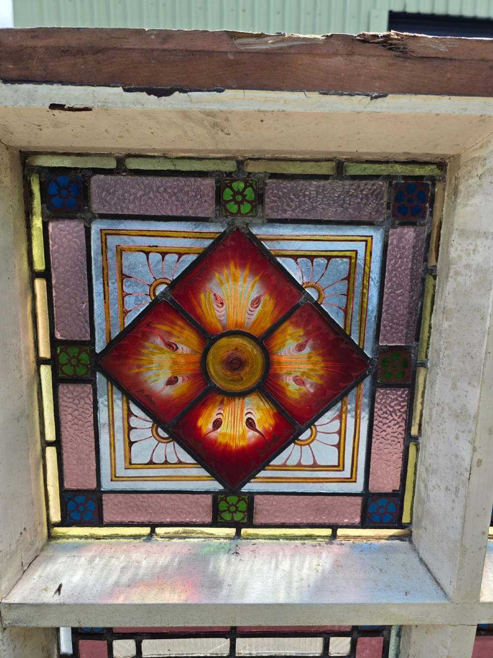 1880 antique leaded glass window with amber and green bullseyes and birds on flowers design  View X
