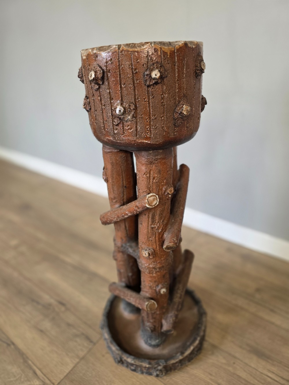 A 19th-century brown glazed ceramic jardiniere and stand textured to resemble tree bark and interlaced log branches. View III