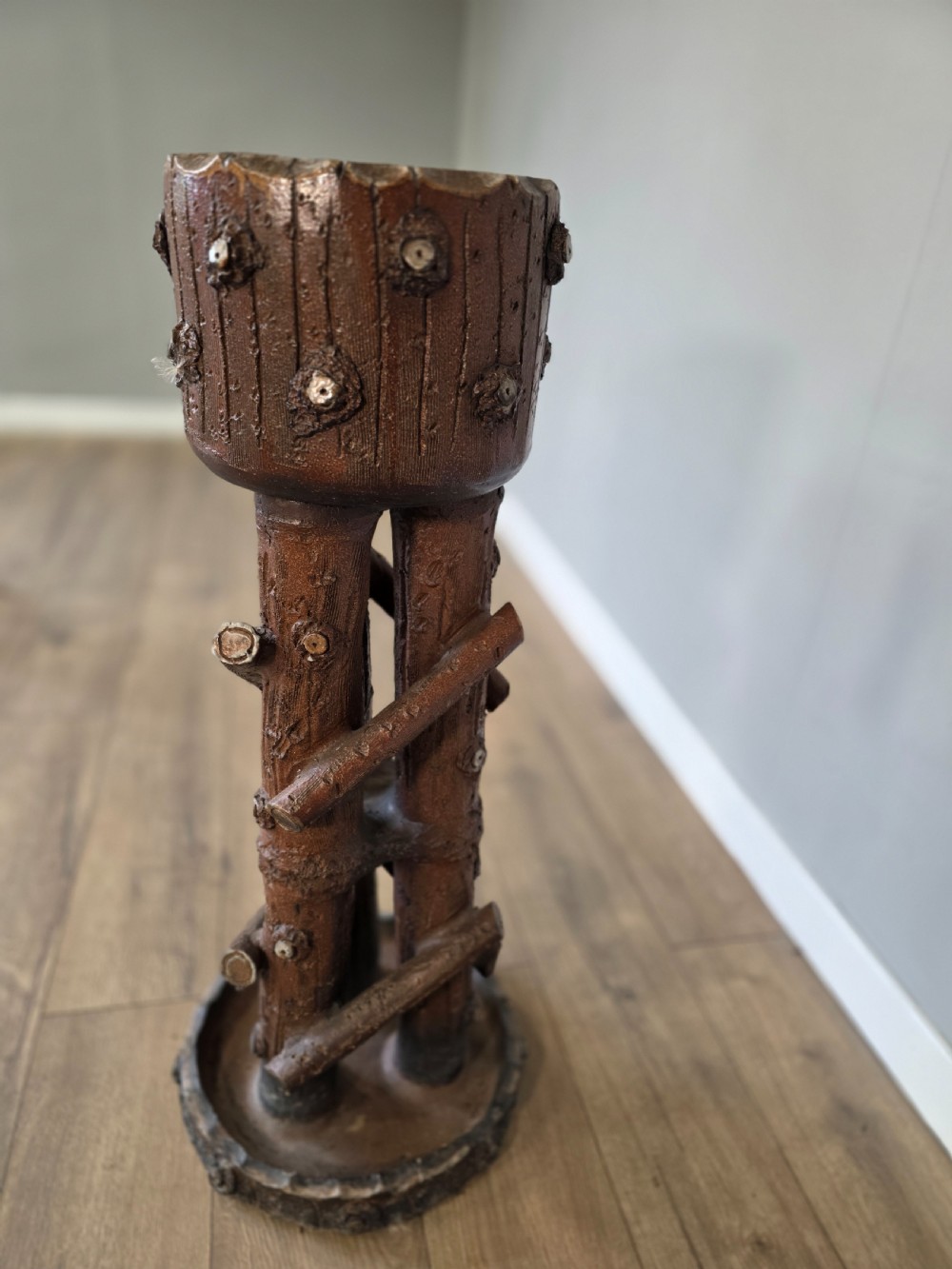 A 19th-century brown glazed ceramic jardiniere and stand textured to resemble tree bark and interlaced log branches. View VII