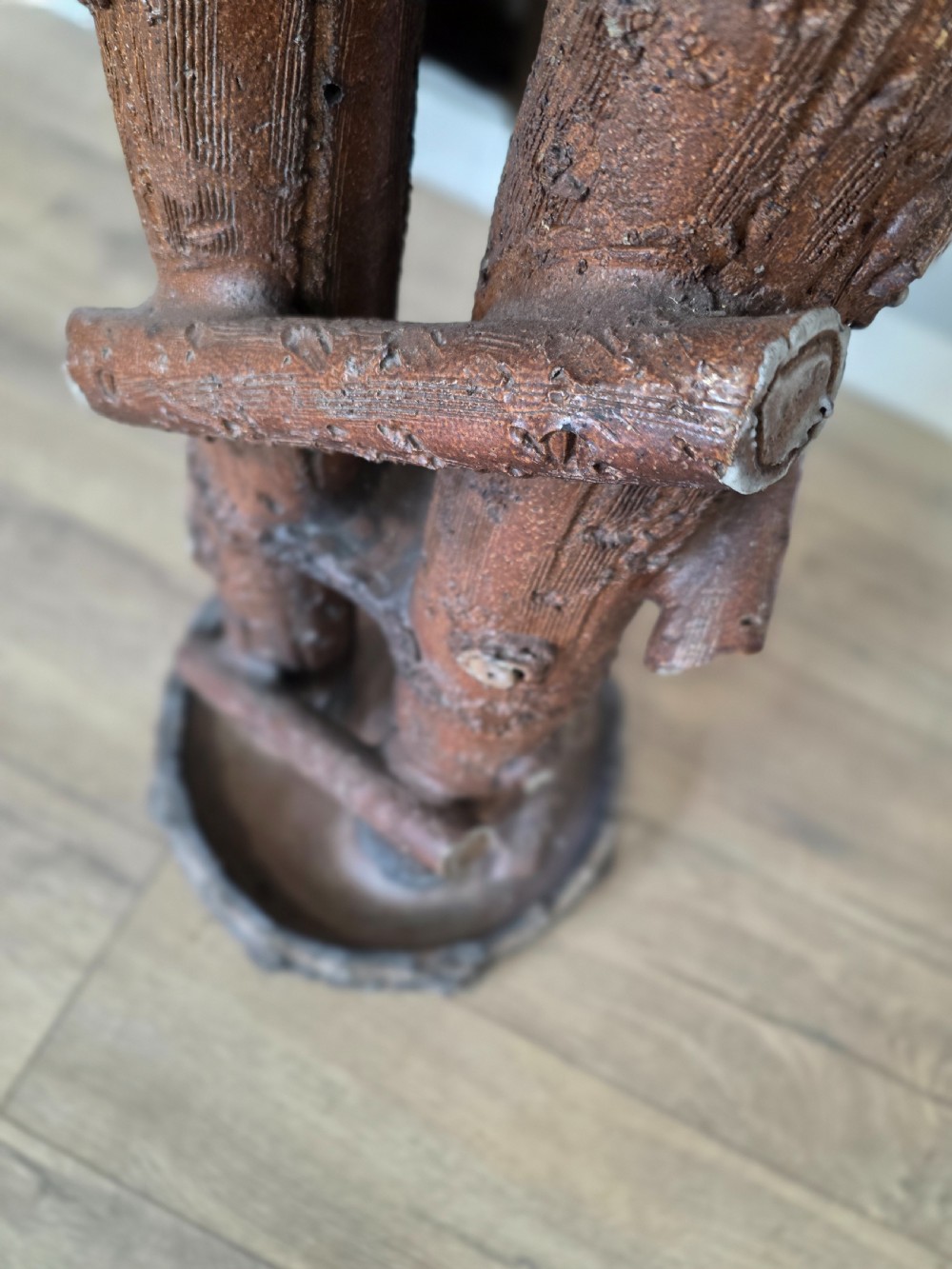A 19th-century brown glazed ceramic jardiniere and stand textured to resemble tree bark and interlaced log branches. View VIII