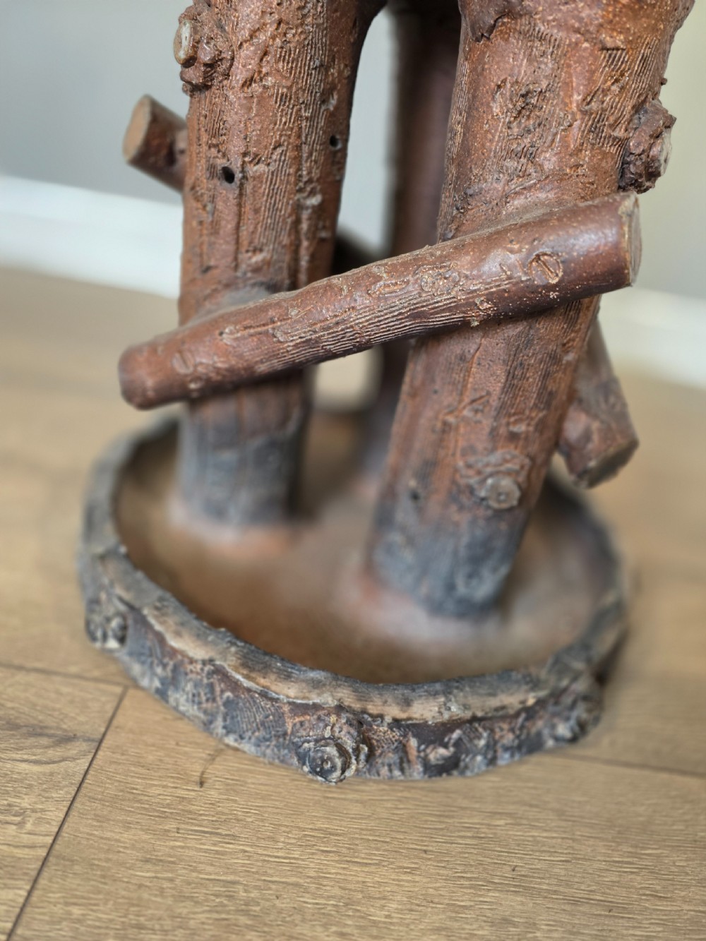 A 19th-century brown glazed ceramic jardiniere and stand textured to resemble tree bark and interlaced log branches. View IX