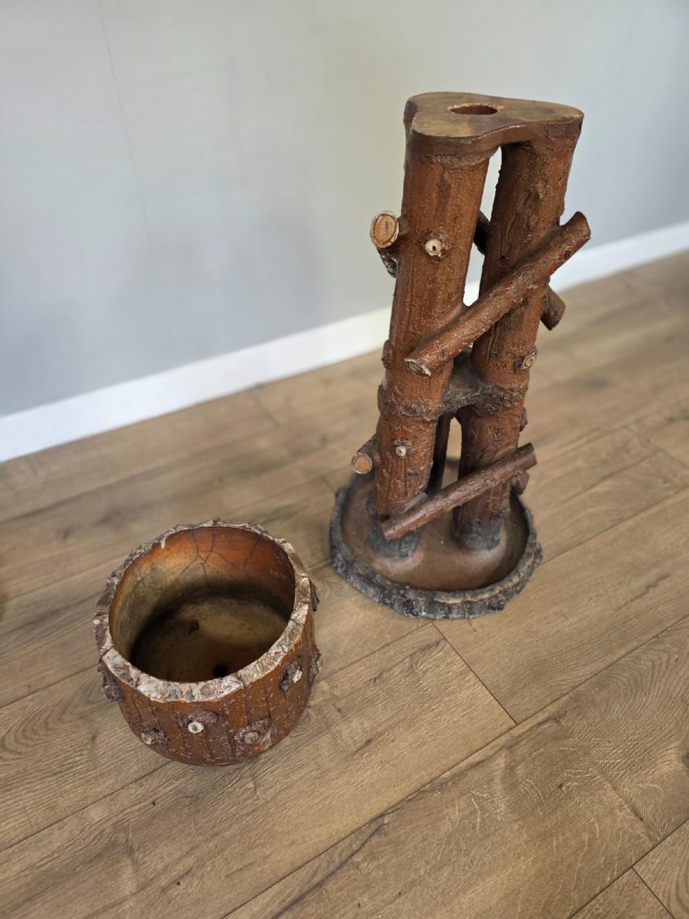 A 19th-century brown glazed ceramic jardiniere and stand textured to resemble tree bark and interlaced log branches. View XIII