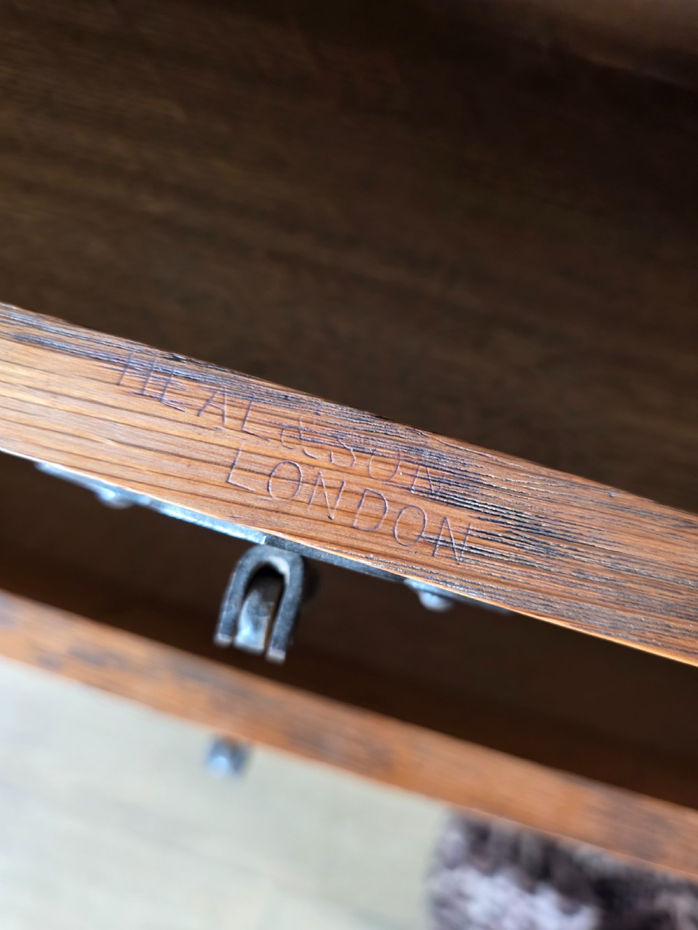 An Arts and Crafts solid oak dressing table featuring an upper mirror superstructure with side trinket drawers above a lower four-drawer chest with dark metal handles. View XIV