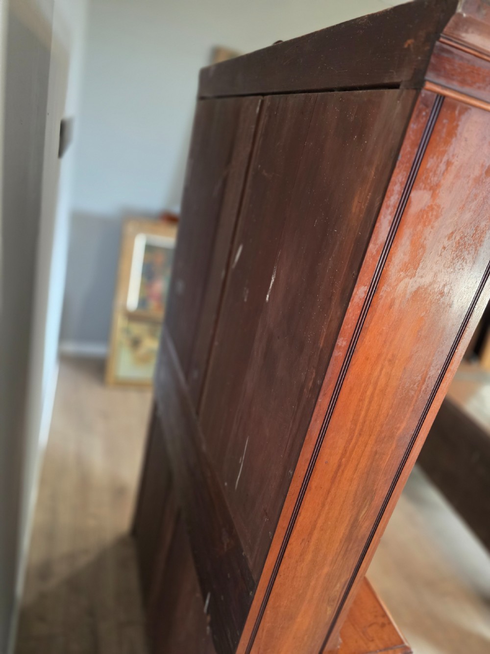 A Victorian mahogany glazed bookcase featuring a top spindle gallery, two glass cabinet doors, two drawers, and a lower double door cupboard on a plinth base. View XXI