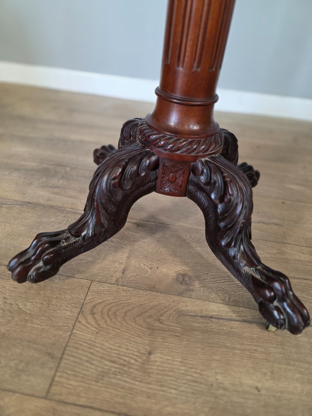 A tall mahogany gentlemans shaving stand featuring an adjustable rectangular mirror, a single drawer pedestal, a fluted column, and a carved tripod base. View XVIII