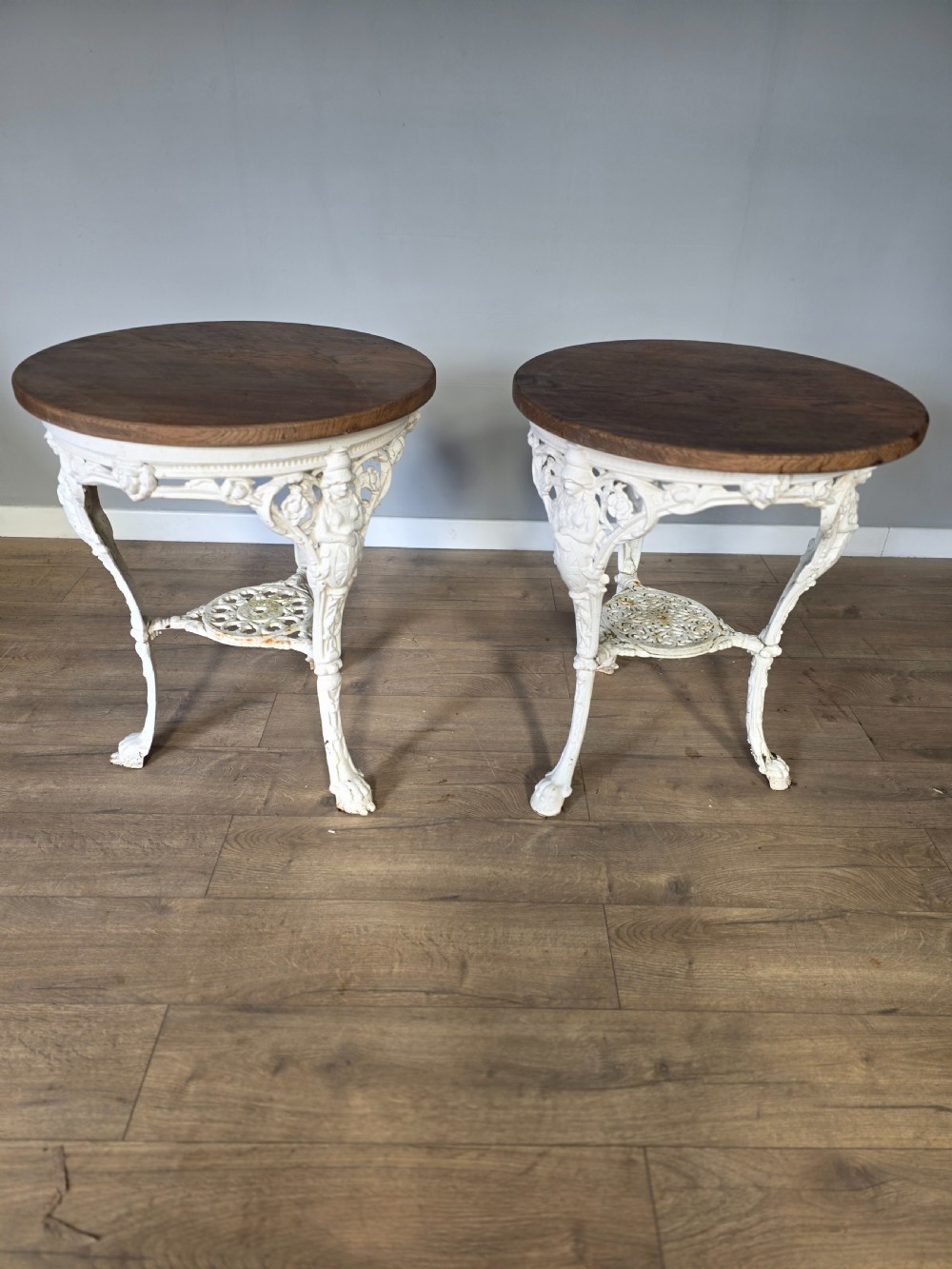 Near Pair Of Cast Iron Victorian Britannia Pub Tables with Matching Solid Oak Tops. 