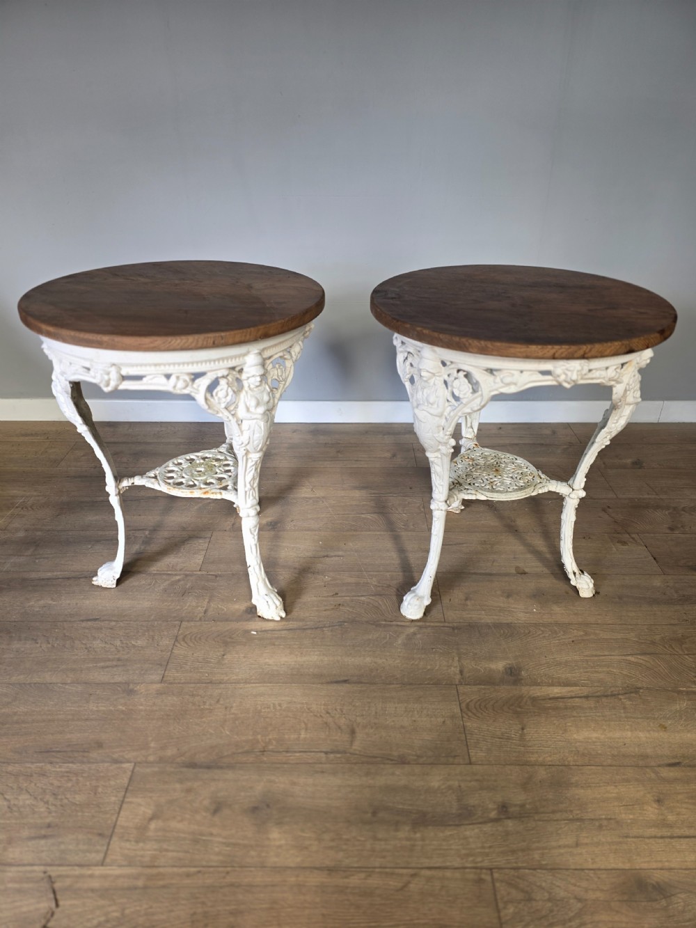 Near Pair Of Cast Iron Victorian Britannia Pub Tables with Matching Solid Oak Tops.  View II