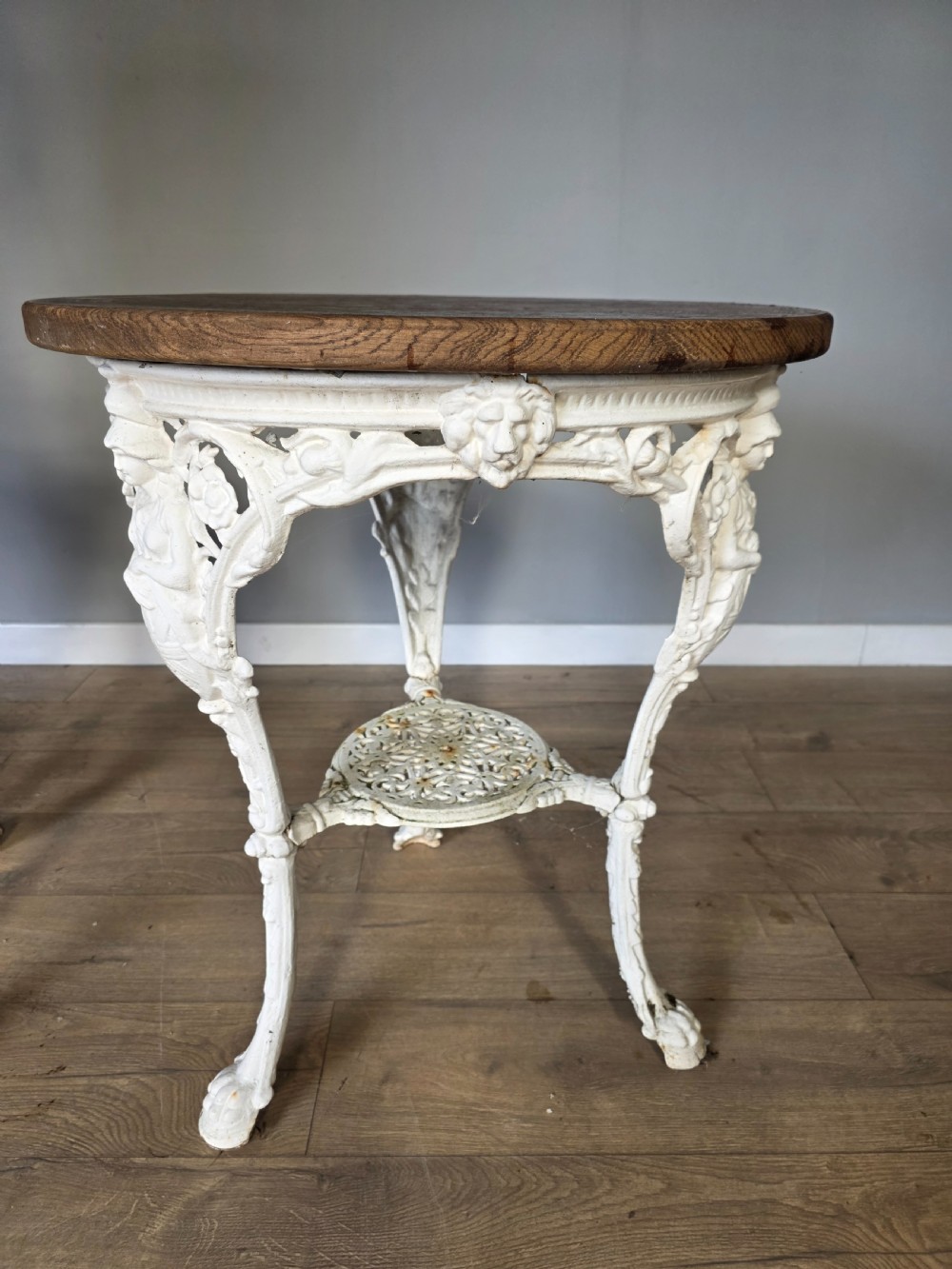 Near Pair Of Cast Iron Victorian Britannia Pub Tables with Matching Solid Oak Tops.  View VI