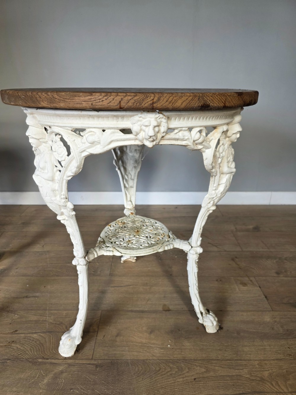 Near Pair Of Cast Iron Victorian Britannia Pub Tables with Matching Solid Oak Tops.  View VII