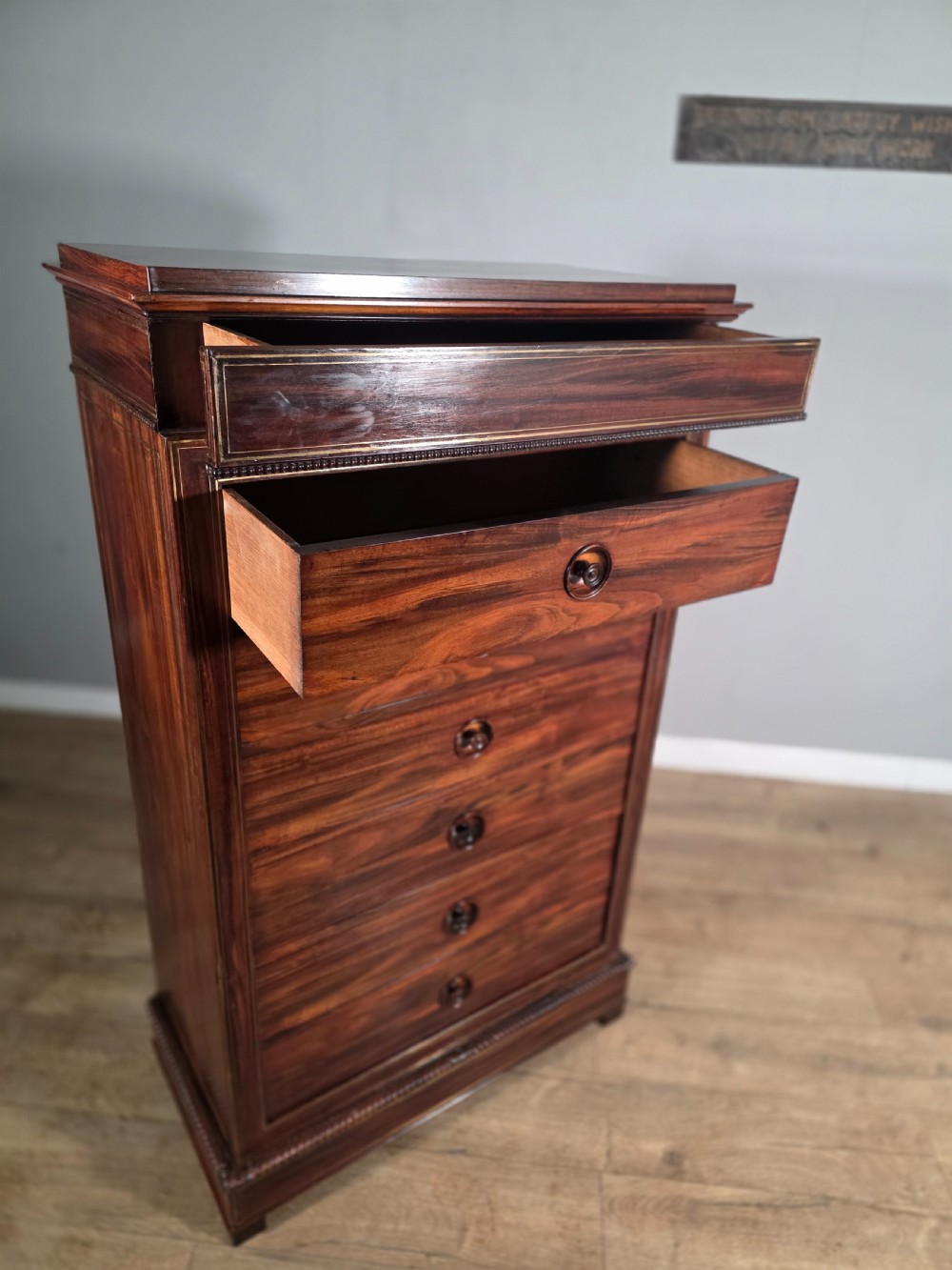 A tall 19th-century French rosewood chest featuring six drawers decorated with brass inlay stringing and turned wooden handles. View XIII