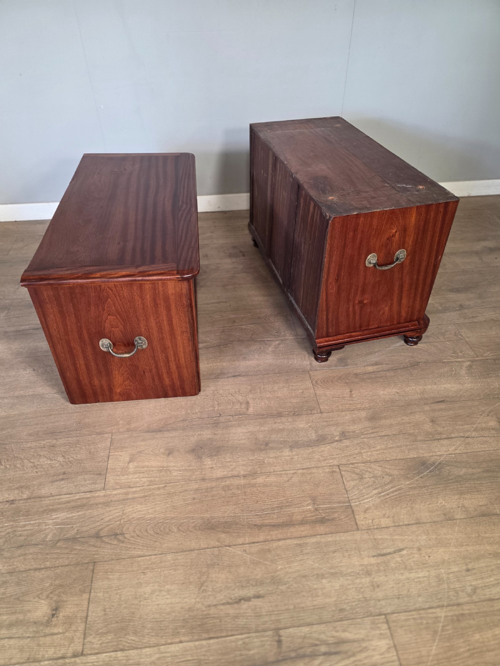 A 19th-century teak military campaign chest of drawers featuring a two-part split design with flush brass handles and turned feet. View XI