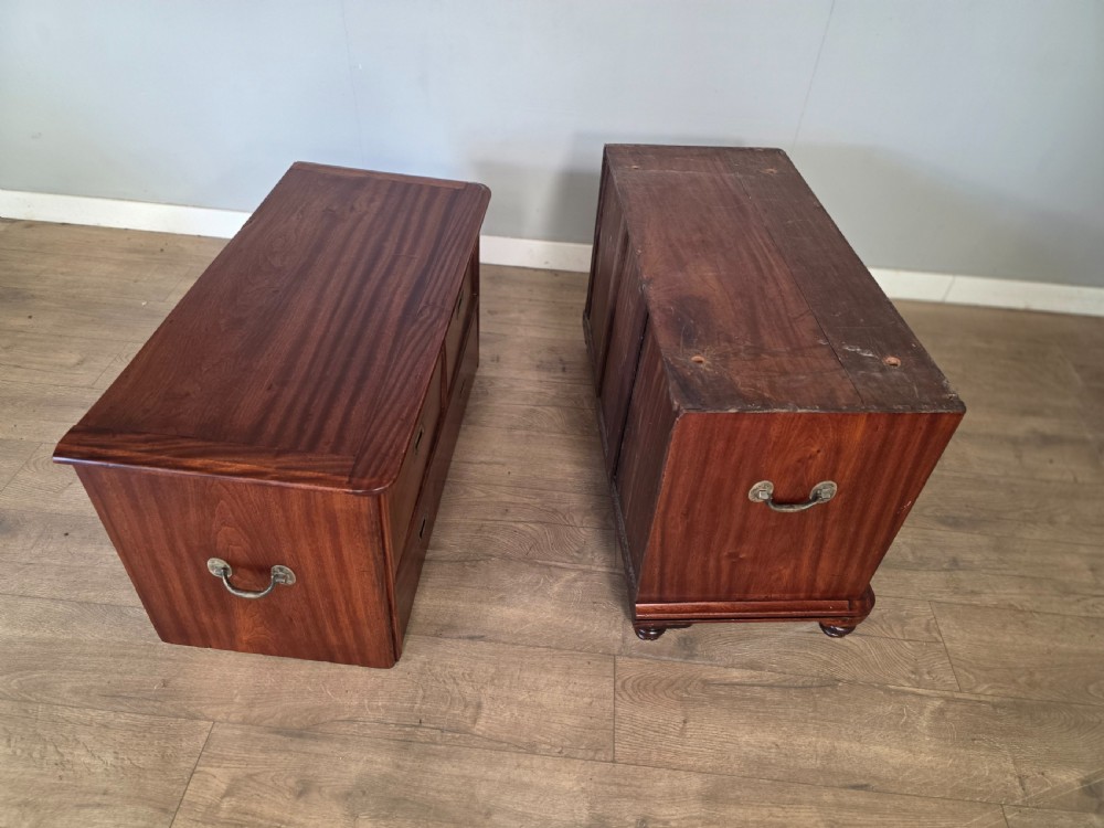 A 19th-century teak military campaign chest of drawers featuring a two-part split design with flush brass handles and turned feet. View XII