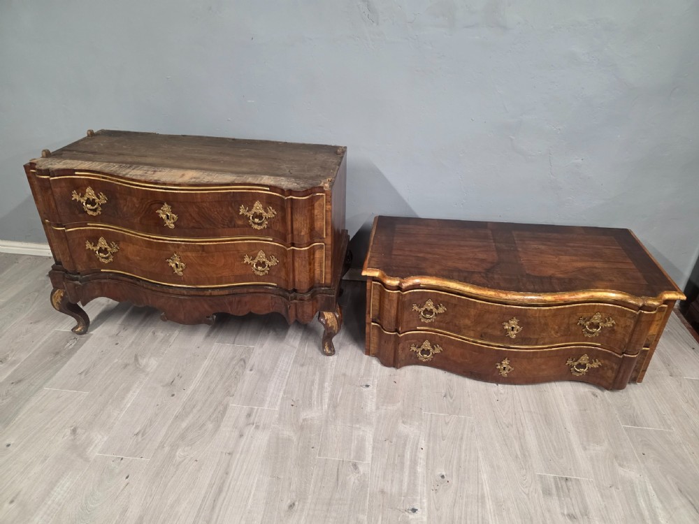 An 18th-century walnut chest of drawers featuring a serpentine front, four drawers, ornate brass handles, and short cabriole legs. View XIII