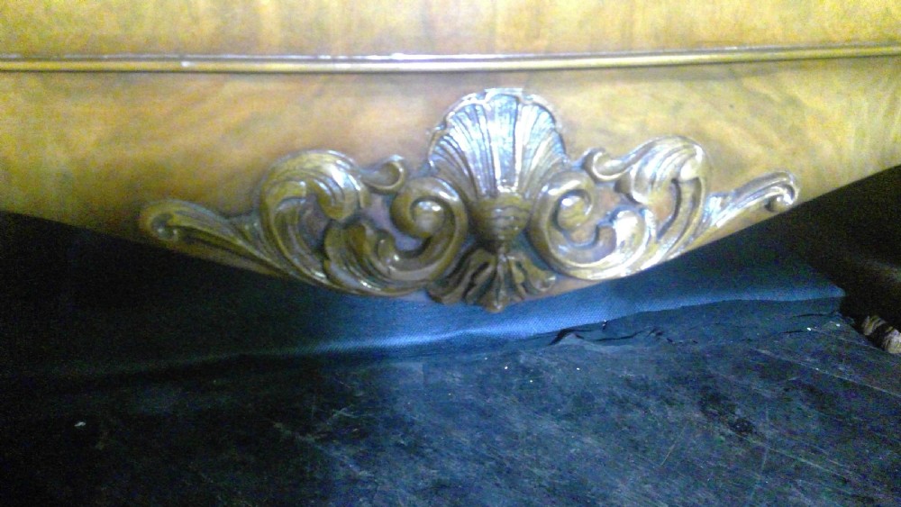 A burr walnut Queen Anne style sideboard featuring two central drawers flanked by cupboard doors, resting on carved cabriole legs with claw and ball feet. View VII