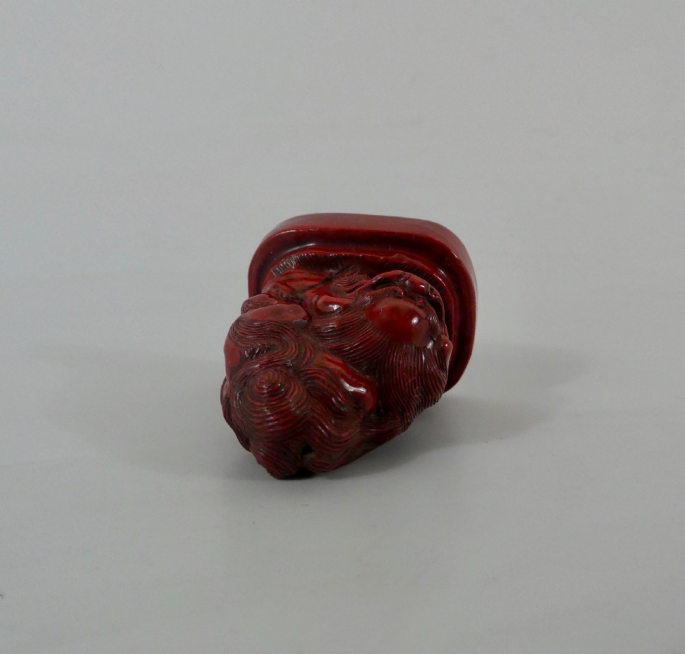 Japanese red lacquer netsuke, c. 1820, Edo Period. View IV