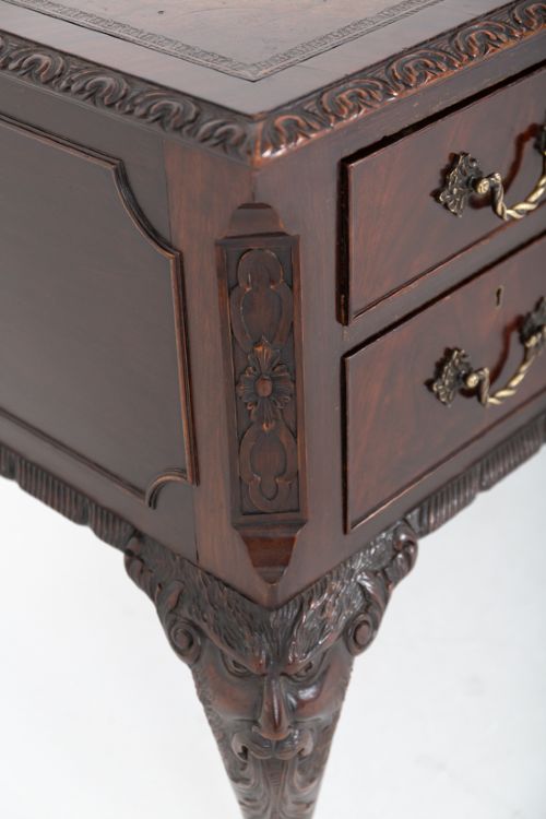 A dark mahogany Chippendale style writing desk featuring an inset leather top, carved cabriole legs with ball-and-claw feet, and brass drawer handles. View VII