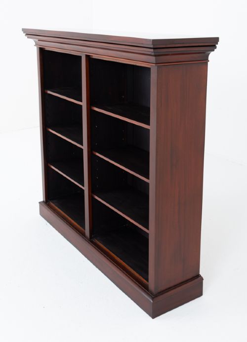 A dark Victorian mahogany open bookcase featuring two sections, adjustable shelving, a moulded top cornice, and a solid plinth base. View III