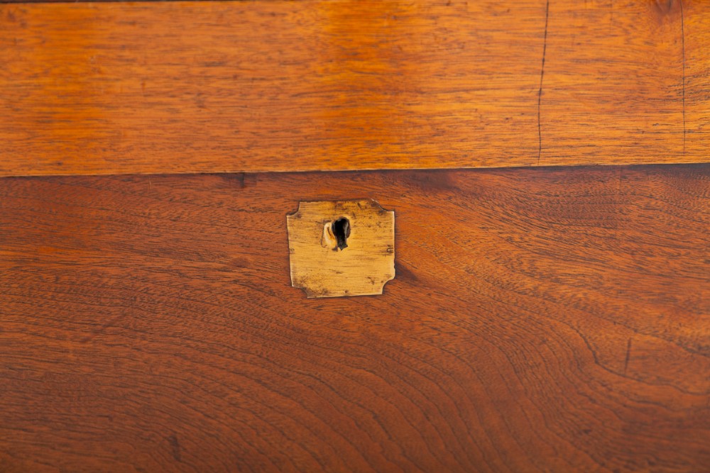 A rectangular camphor wood military campaign trunk featuring brass corner mounts, flush-fitting brass hardware, and iron side carrying handles. View VIII