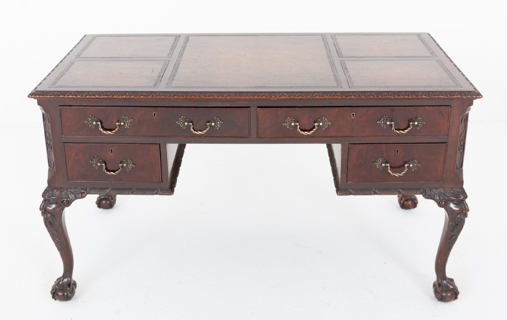 A dark mahogany Chippendale style writing desk featuring an inset leather top, carved cabriole legs with ball-and-claw feet, and brass drawer handles. View IX